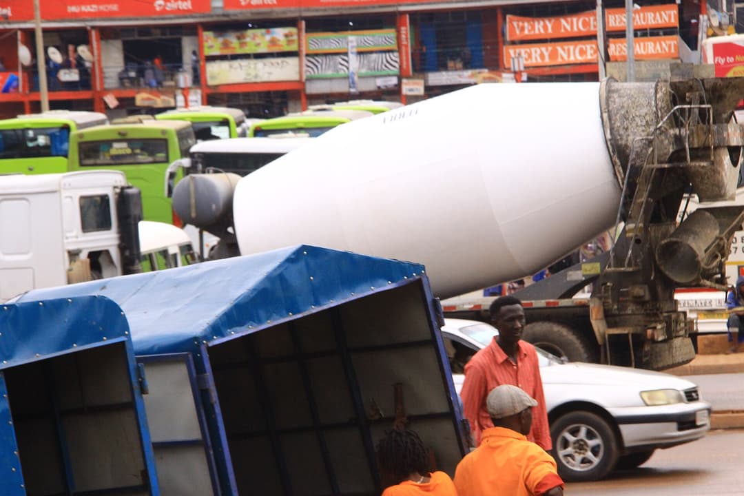 A concrete mixer truck on a construction site