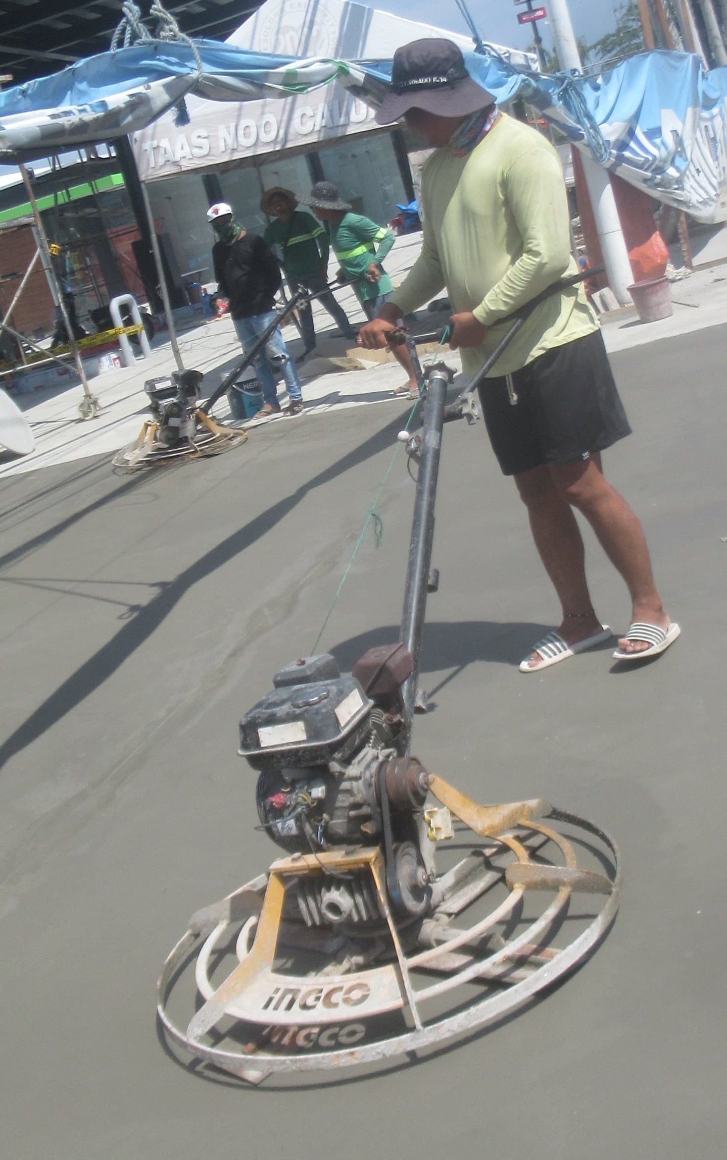 A power trowel finishing a concrete slab
