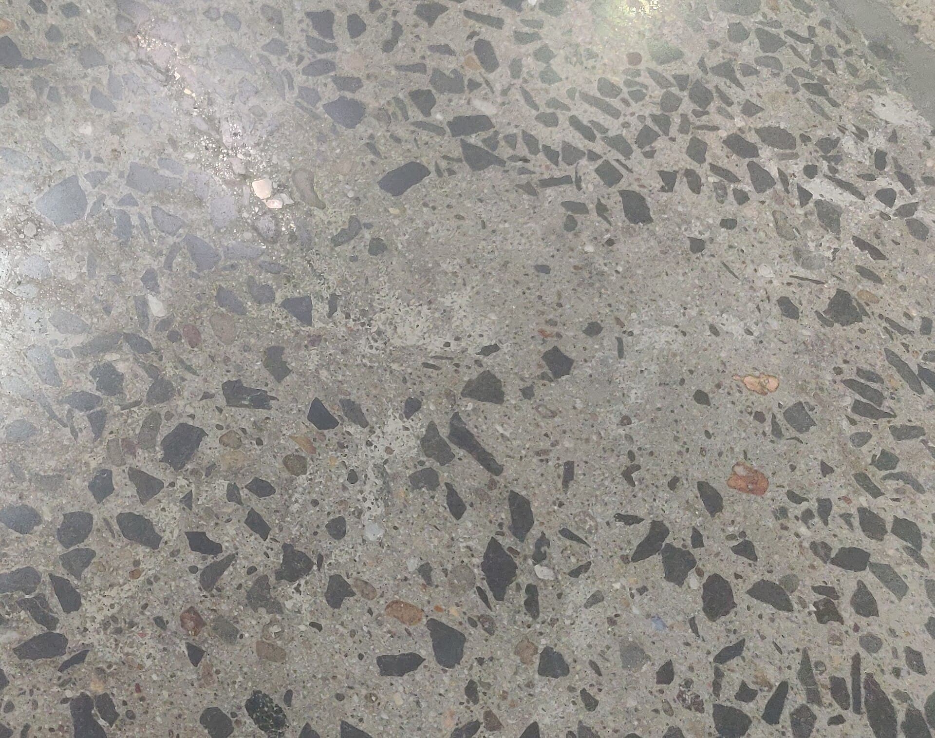 Early damage patches on a concrete floor