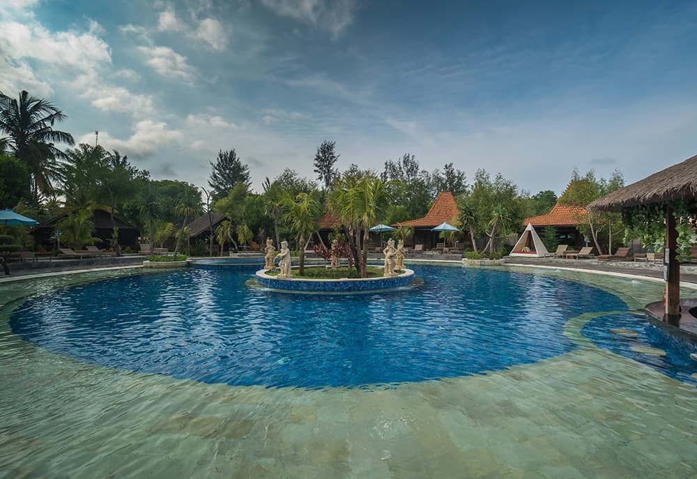 A swimming pool with surrounding deck